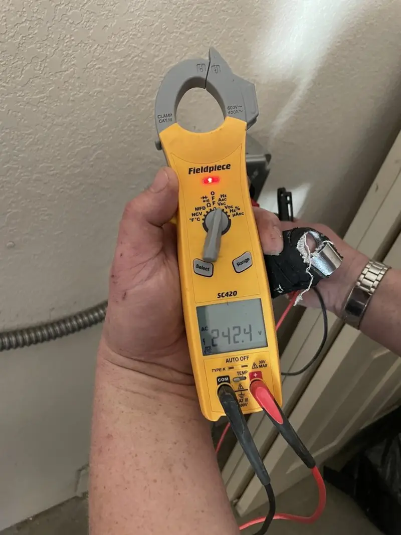 Voltage testing with clamp meter during Recessed Lighting Installation in Norwood